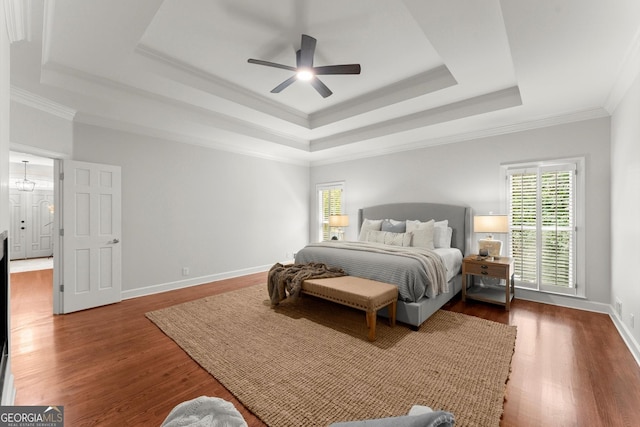 5455 Malone Ct, Powder Springs, GA 30127 - bedroom with a tray ceiling, dark wood finished floors, crown molding, and a ceiling fan