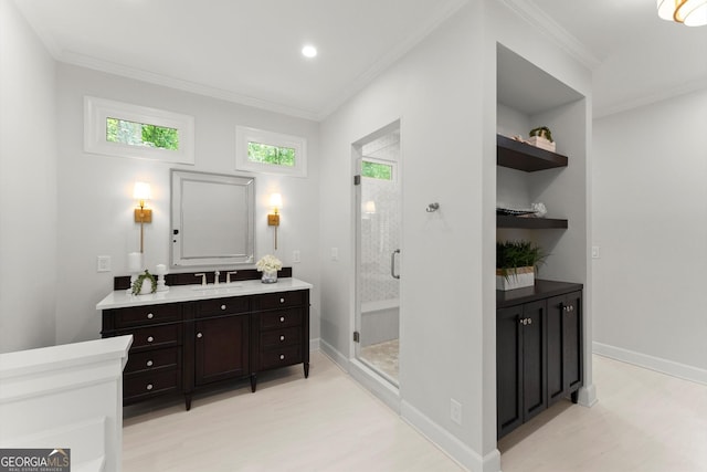 5455 Malone Ct, Powder Springs, GA 30127 - bathroom featuring vanity, a stall shower, ornamental molding, wood finished floors, and recessed lighting