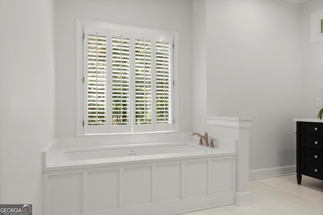 5455 Malone Ct, Powder Springs, GA 30127 - bathroom featuring plenty of natural light, a garden tub, and vanity