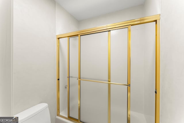 5455 Malone Ct, Powder Springs, GA 30127 - bathroom featuring toilet and enclosed tub / shower combo