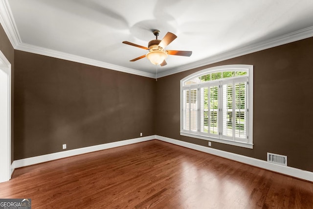 5455 Malone Ct, Powder Springs, GA 30127 - spare room with wood finished floors, a ceiling fan, and crown molding
