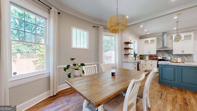 1437 18th St, Columbus, GA 31901 - dining space featuring healthy amount of natural light, ornamental molding, light wood-type flooring, a chandelier, and recessed lighting