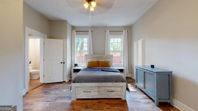 1437 18th St, Columbus, GA 31901 - bedroom featuring wood finished floors, ensuite bathroom, and a ceiling fan