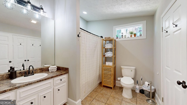 1437 18th St, Columbus, GA 31901 - bathroom featuring vanity, tile patterned flooring, a textured ceiling, and a shower with shower curtain