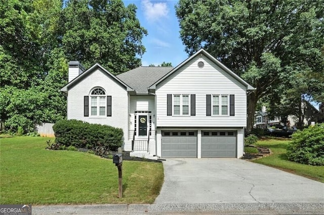 1361 Chatley Way, Woodstock, GA 30188 - bi-level home featuring a chimney, driveway, and a garage