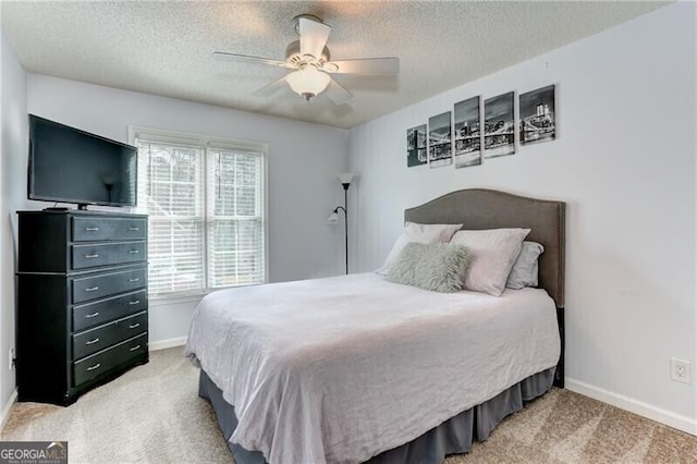 1361 Chatley Way, Woodstock, GA 30188 - bedroom featuring light colored carpet, a textured ceiling, and ceiling fan