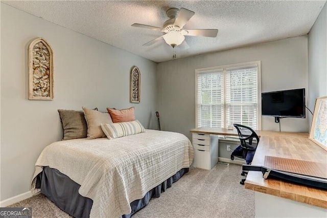 1361 Chatley Way, Woodstock, GA 30188 - carpeted bedroom with a textured ceiling, a ceiling fan, and a desk