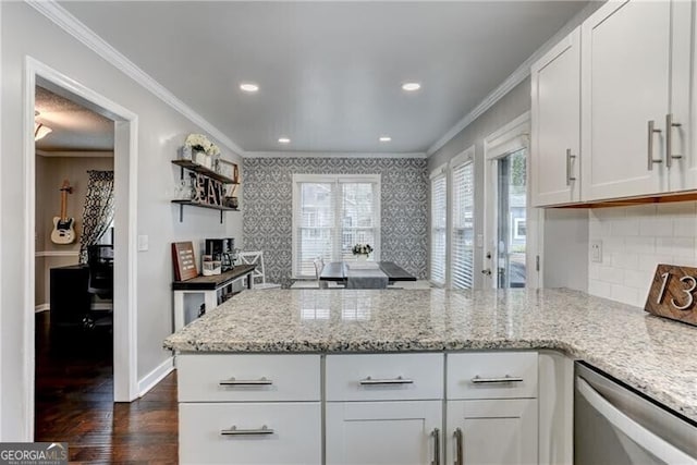 1361 Chatley Way, Woodstock, GA 30188 - kitchen featuring dishwasher, a peninsula, crown molding, dark wood finished floors, and white cabinets