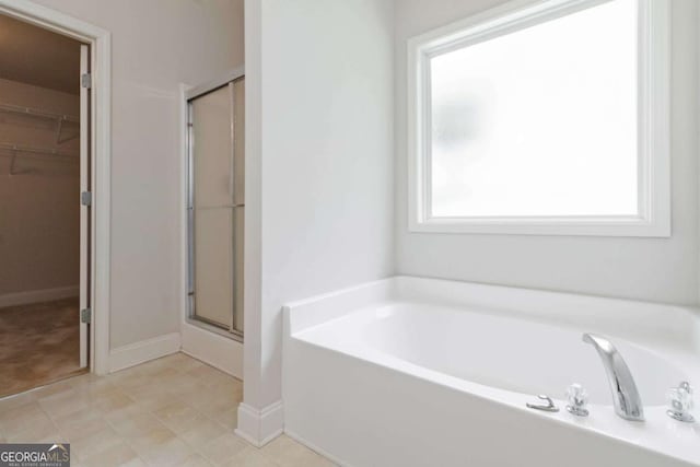 154 Ashebrooke Way, Jefferson, GA 30549 - full bathroom with a stall shower, a bath, and a walk in closet