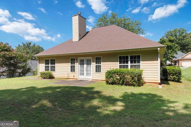 154 Ashebrooke Way, Jefferson, GA 30549 - back of property featuring french doors, a chimney, a yard, and a shingled roof