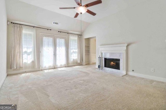 154 Ashebrooke Way, Jefferson, GA 30549 - unfurnished living room featuring ceiling fan, lofted ceiling, carpet floors, a fireplace, and built in shelves