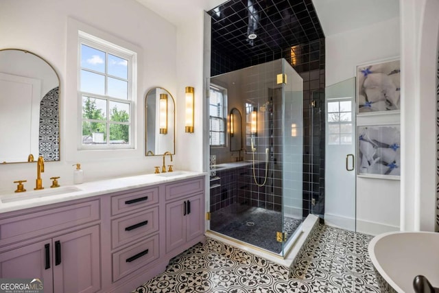 11277 Serenbe Ln, Chattahoochee Hills, GA 30268 - bathroom with a shower stall, double vanity, a soaking tub, and tile patterned floors