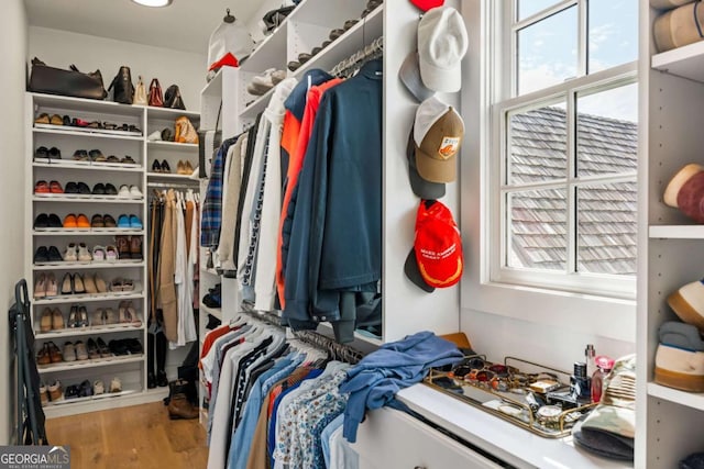 11277 Serenbe Ln, Chattahoochee Hills, GA 30268 - walk in closet featuring wood finished floors
