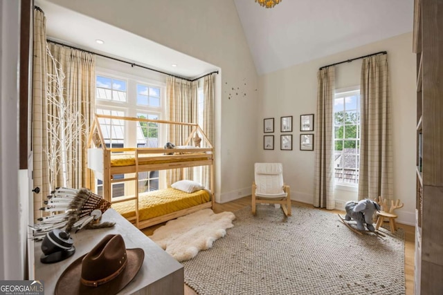 11277 Serenbe Ln, Chattahoochee Hills, GA 30268 - living area with plenty of natural light, wood finished floors, recessed lighting, and high vaulted ceiling