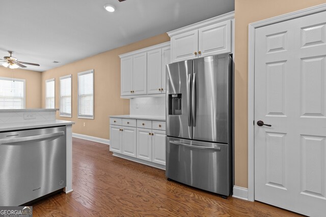 3209 Telhurst Way, Buford, GA 30519 - kitchen featuring appliances with stainless steel finishes, a ceiling fan, dark wood-style flooring, white cabinets, and recessed lighting