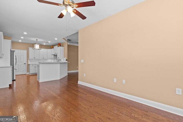3209 Telhurst Way, Buford, GA 30519 - unfurnished living room featuring ceiling fan, recessed lighting, and wood finished floors
