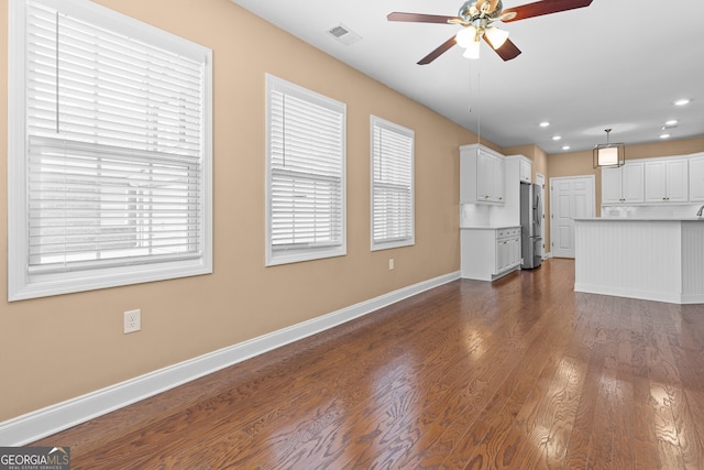 3209 Telhurst Way, Buford, GA 30519 - unfurnished living room featuring ceiling fan, healthy amount of natural light, dark wood-style floors, and recessed lighting