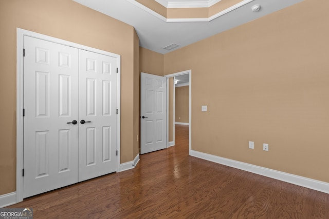 3209 Telhurst Way, Buford, GA 30519 - unfurnished bedroom with dark wood-style floors, a closet, and crown molding