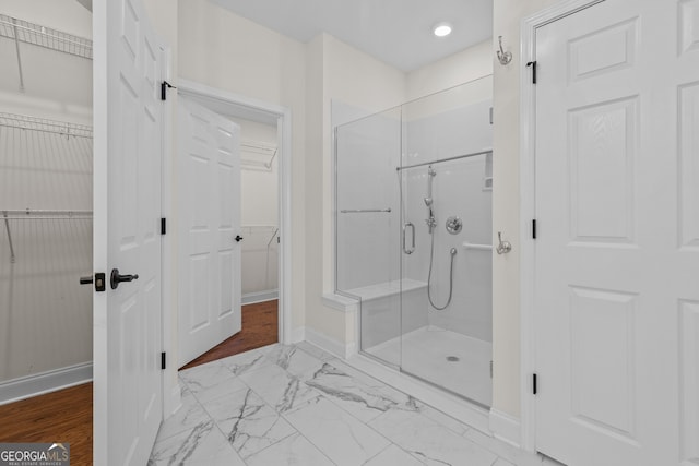 3209 Telhurst Way, Buford, GA 30519 - bathroom with a stall shower, marble finish flooring, a spacious closet, and recessed lighting