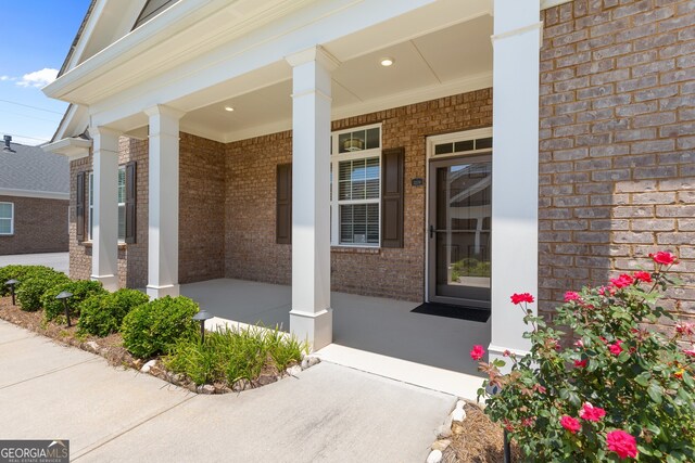 3209 Telhurst Way, Buford, GA 30519 - property entrance featuring covered porch and brick siding