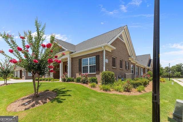 3209 Telhurst Way, Buford, GA 30519 - view of front of home with a front lawn, brick siding, and a shingled roof