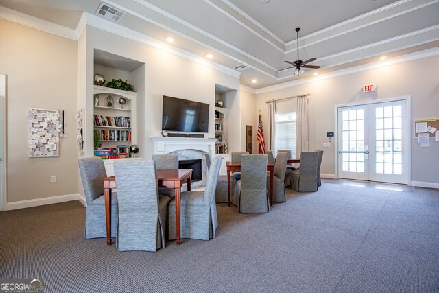 3209 Telhurst Way, Buford, GA 30519 - dining area featuring a ceiling fan, carpet flooring, a premium fireplace, ornamental molding, and french doors