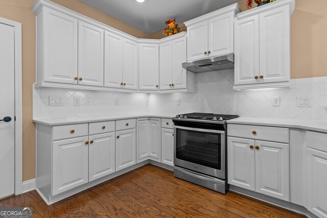 3209 Telhurst Way, Buford, GA 30519 - kitchen with stainless steel range with gas cooktop, under cabinet range hood, light countertops, dark wood-style floors, and white cabinetry
