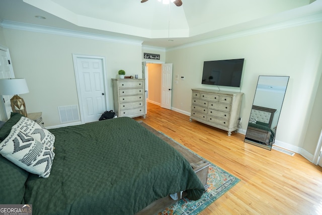 97 Windermere Cir, Newnan, GA 30265 - bedroom featuring a raised ceiling, wood finished floors, and crown molding