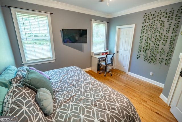 97 Windermere Cir, Newnan, GA 30265 - bedroom featuring wood finished floors, ornamental molding, multiple windows, and a desk