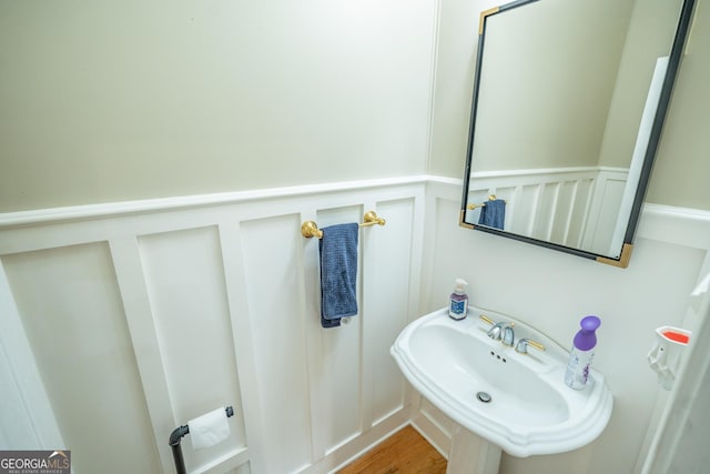 97 Windermere Cir, Newnan, GA 30265 - bathroom with a decorative wall and wood finished floors