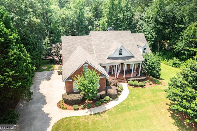 97 Windermere Cir, Newnan, GA 30265 - view of front of property with concrete driveway, covered porch, a front lawn, and a shingled roof