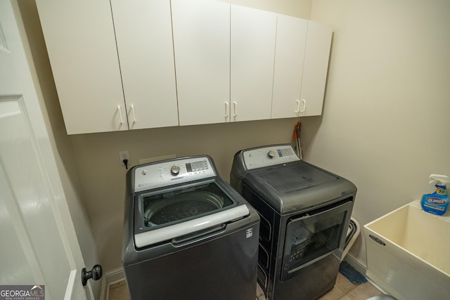 97 Windermere Cir, Newnan, GA 30265 - laundry area featuring washing machine and clothes dryer and cabinet space