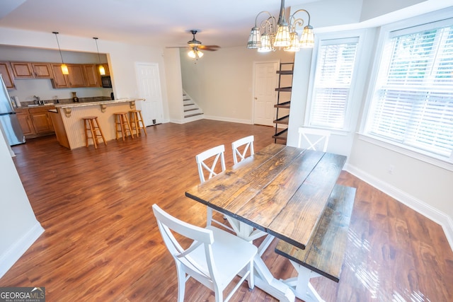 97 Windermere Cir, Newnan, GA 30265 - dining area with stairway, ceiling fan, dark wood-style flooring, and a chandelier