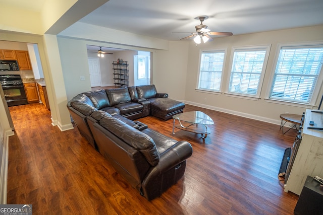 97 Windermere Cir, Newnan, GA 30265 - living room featuring ceiling fan and dark wood finished floors