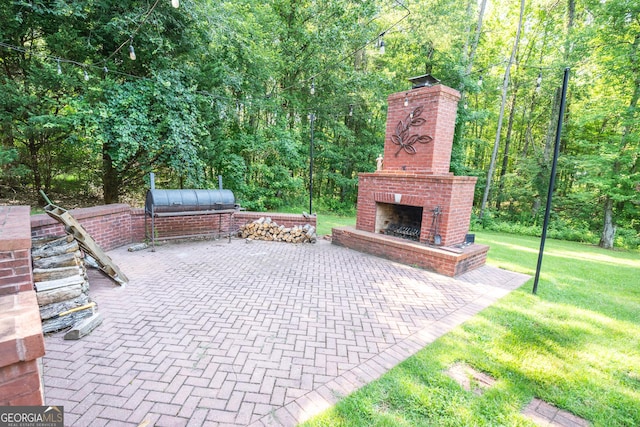 97 Windermere Cir, Newnan, GA 30265 - view of patio / terrace with an outdoor brick fireplace and a view of trees
