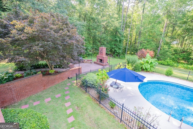97 Windermere Cir, Newnan, GA 30265 - view of pool with an outdoor fireplace, a patio area, and a view of trees