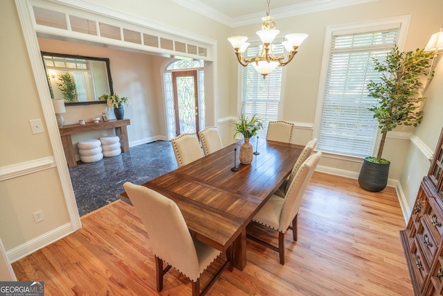 97 Windermere Cir, Newnan, GA 30265 - dining room with a chandelier, light wood finished floors, and ornamental molding