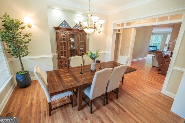 97 Windermere Cir, Newnan, GA 30265 - dining room featuring light wood-type flooring, a chandelier, and ornamental molding