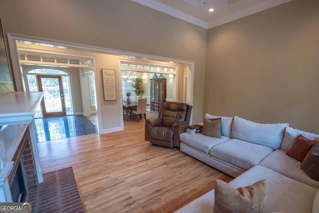 97 Windermere Cir, Newnan, GA 30265 - living room featuring crown molding, light wood finished floors, recessed lighting, and a chandelier