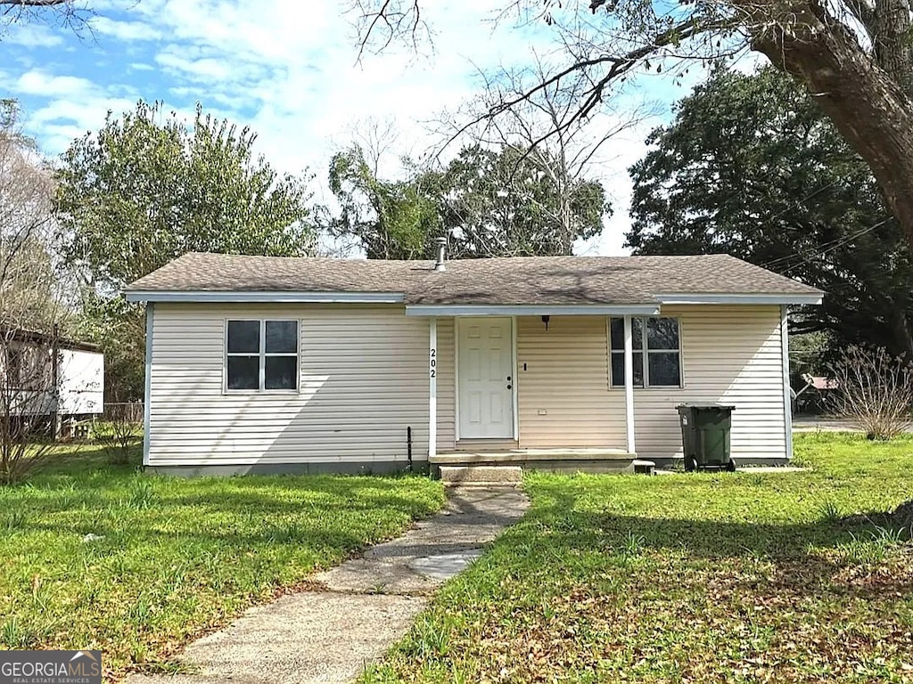 202 Ellington St, Cantonment, FL 32533 - bungalow featuring a front yard