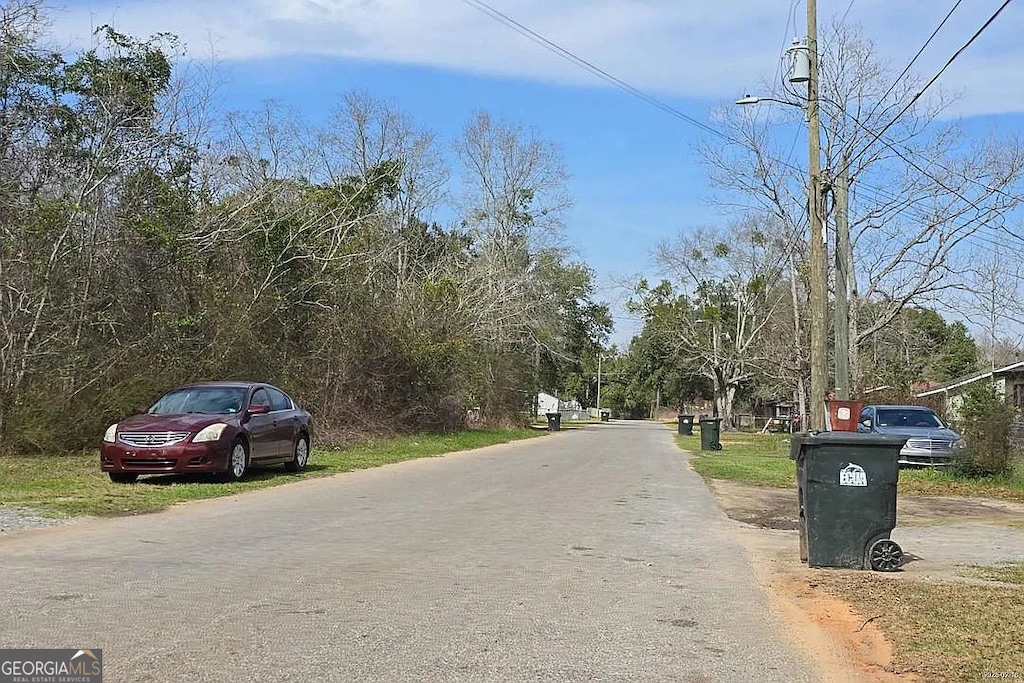 202 Ellington St, Cantonment, FL 32533 - view of asphalt street featuring street lighting