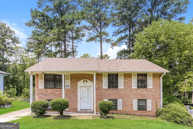 4133 Conley Cir, Conley, GA 30288 - split foyer home featuring brick siding, a front yard, and a shingled roof