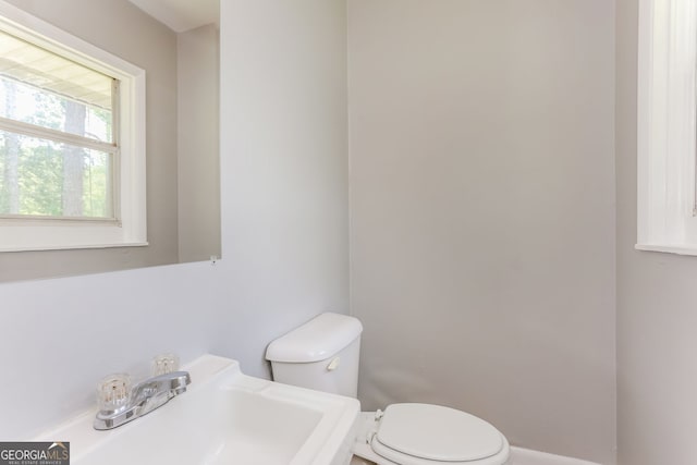 4133 Conley Cir, Conley, GA 30288 - half bathroom featuring a sink and toilet