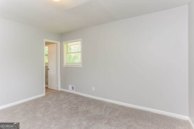4133 Conley Cir, Conley, GA 30288 - spare room with light colored carpet and baseboards