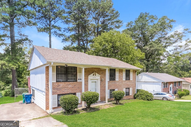 4133 Conley Cir, Conley, GA 30288 - split foyer home with a front lawn, brick siding, and roof with shingles