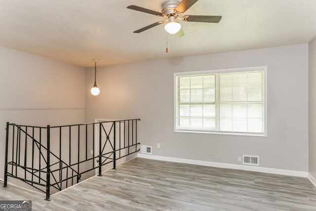 4133 Conley Cir, Conley, GA 30288 - empty room with wood finished floors and ceiling fan