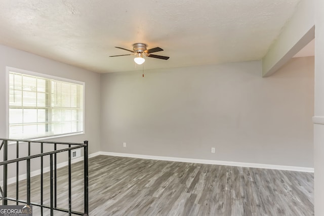 4133 Conley Cir, Conley, GA 30288 - unfurnished room featuring wood finished floors and a ceiling fan