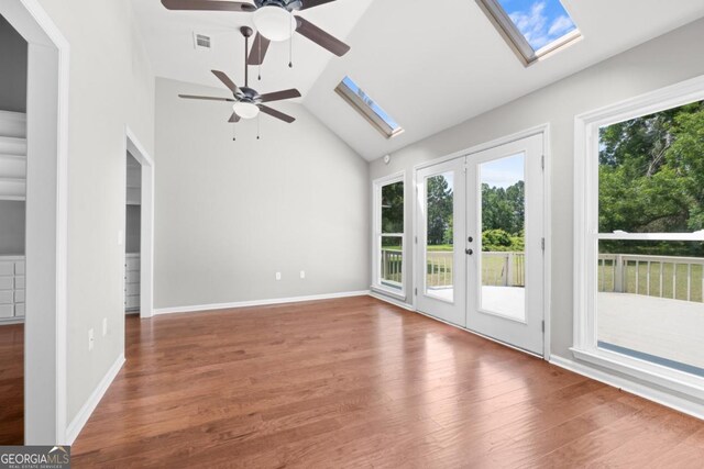 1501 Cayla Way, Statesboro, GA 30458 - spare room featuring a skylight, ceiling fan, vaulted ceiling, wood finished floors, and french doors