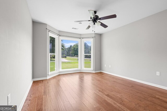 1501 Cayla Way, Statesboro, GA 30458 - spare room featuring wood finished floors and ceiling fan