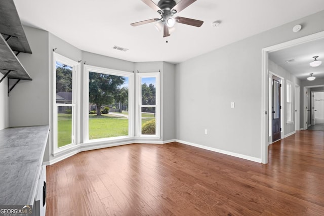 1501 Cayla Way, Statesboro, GA 30458 - spare room with wood finished floors, a ceiling fan, healthy amount of natural light, and a smoke detector